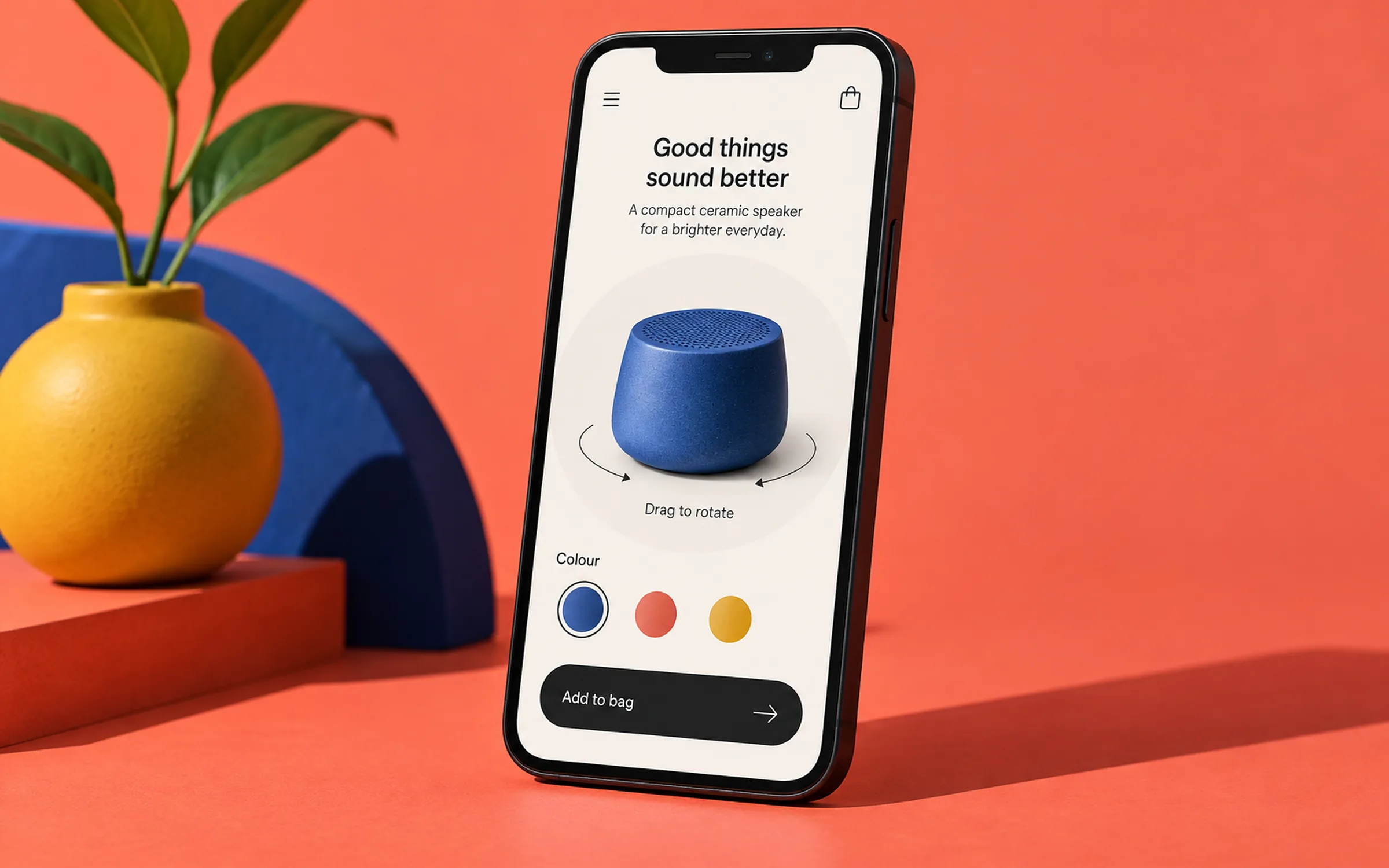 A product-rotation viewer on a phone against a coral backdrop